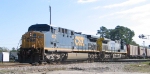 CSX 402 leads an empty coal train westbound across the diamonds